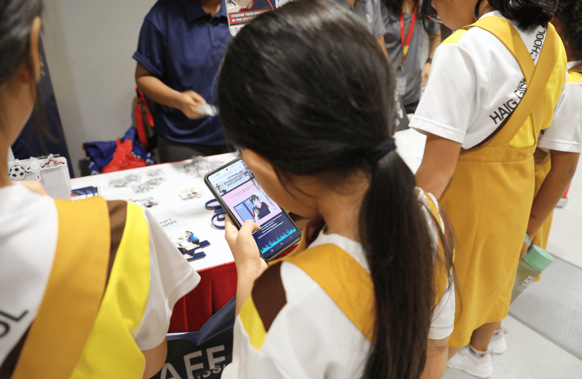 Kids using a smartphone to access an online game