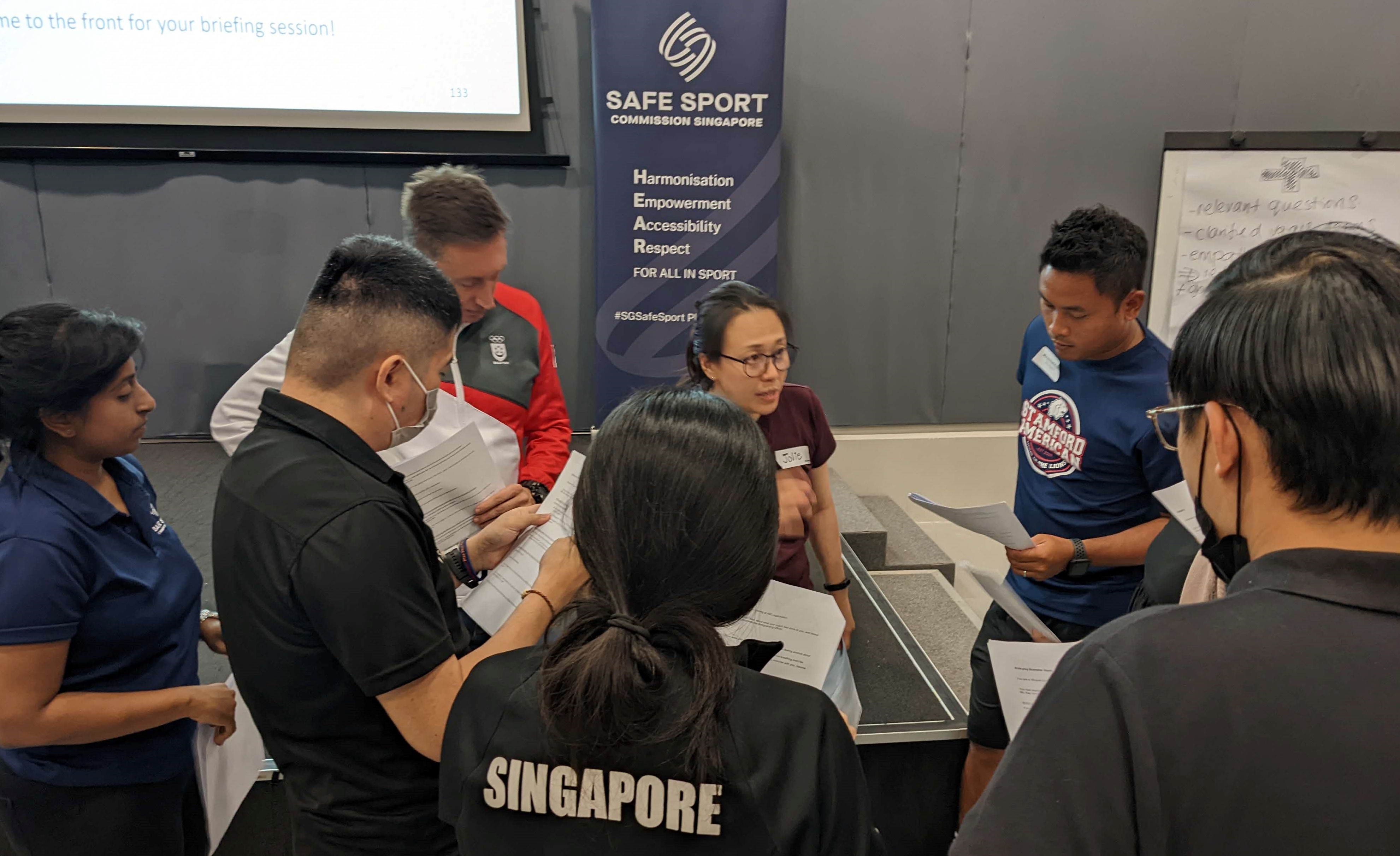 Trainer briefing participants for a small group role play activity